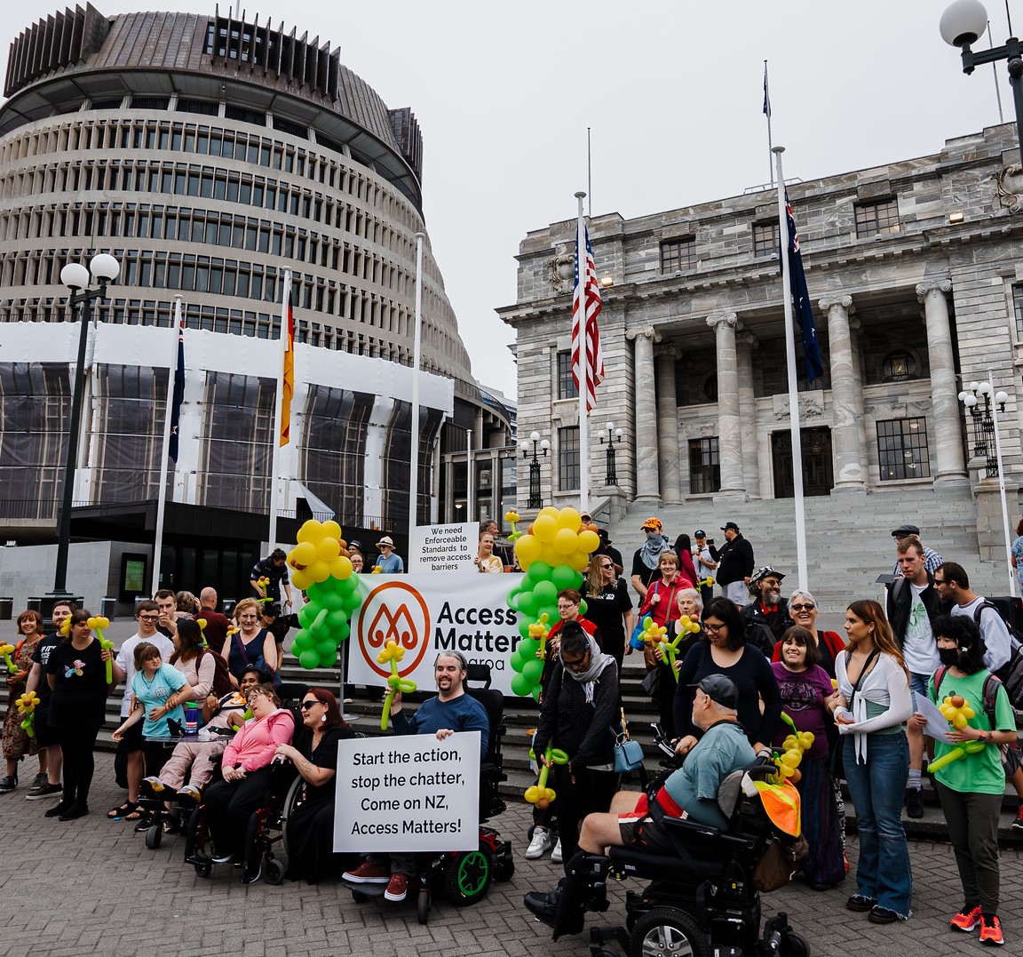 A group of Access Matters campaigners outside of the beehive in Wellington.